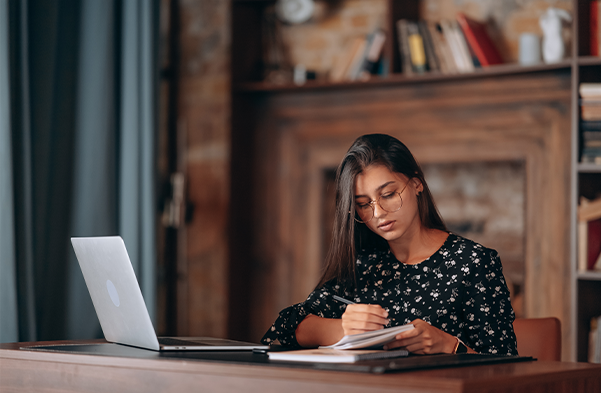 Lady student studying in library